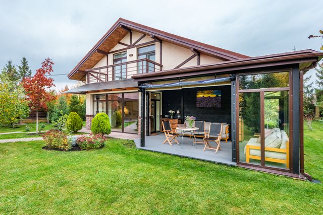 a home with an outdoor entertainment area